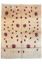 Hand-knotted floral vine Gabbeh rug with burgundy blossoms on a sand-toned wool pile and cotton foundation #2243.
