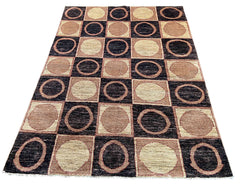 Hand-knotted geometric circular grid Gabbeh rug in cream, charcoal, and terracotta wool on a cotton foundation #3708.