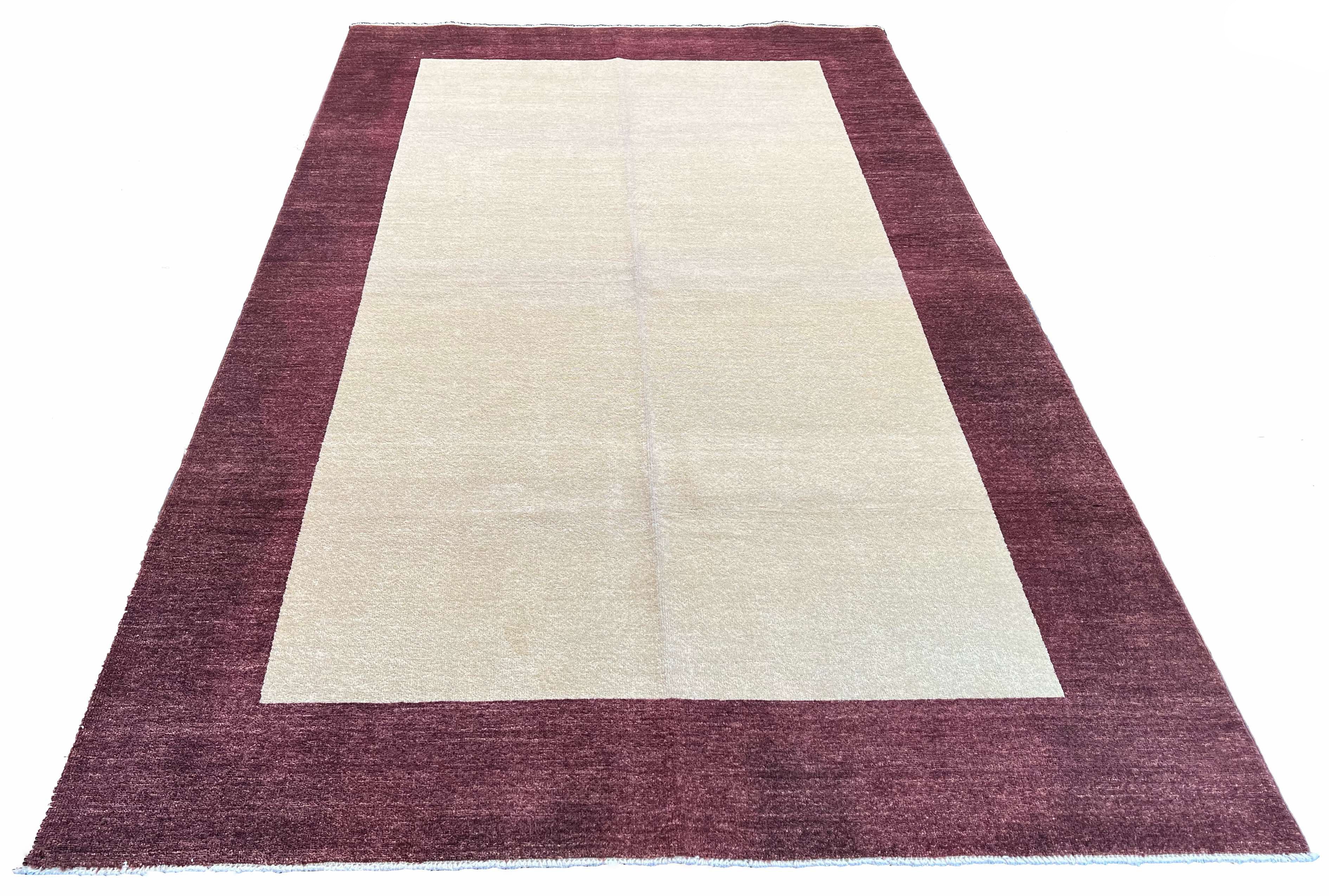 Hand-knotted minimalist border Gabbeh rug in cream and plum burgundy wool on a cotton foundation #3752.