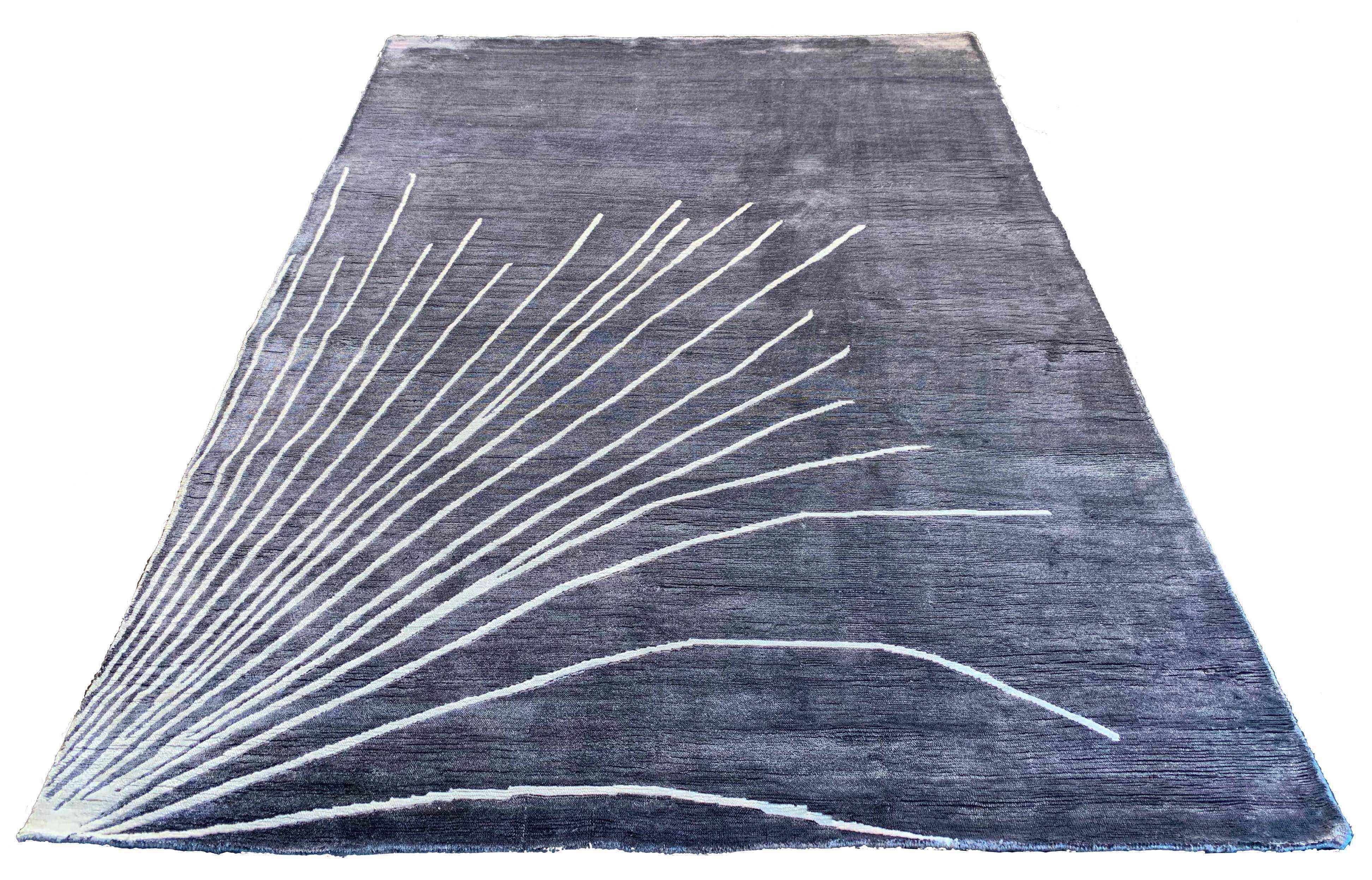 Sleek handmade modern grey rug in 100% bamboo silk with a white abstract fanned-out pattern #7975.