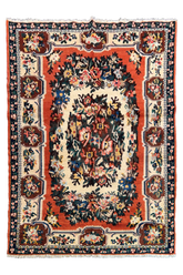 Flat lay top view of hand-knotted Moldavian rug 7569; dark field with vibrant rose floral bouquets in pink and green wool.