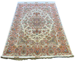 Hand-knotted Persian Beige Tabriz rug in wool on a silk foundation featuring peach floral motifs #5616.