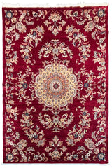 Ornate handmade Pakistan Isfahan rug with a cherry red field, cream central medallion, and floral arabesques #6513.