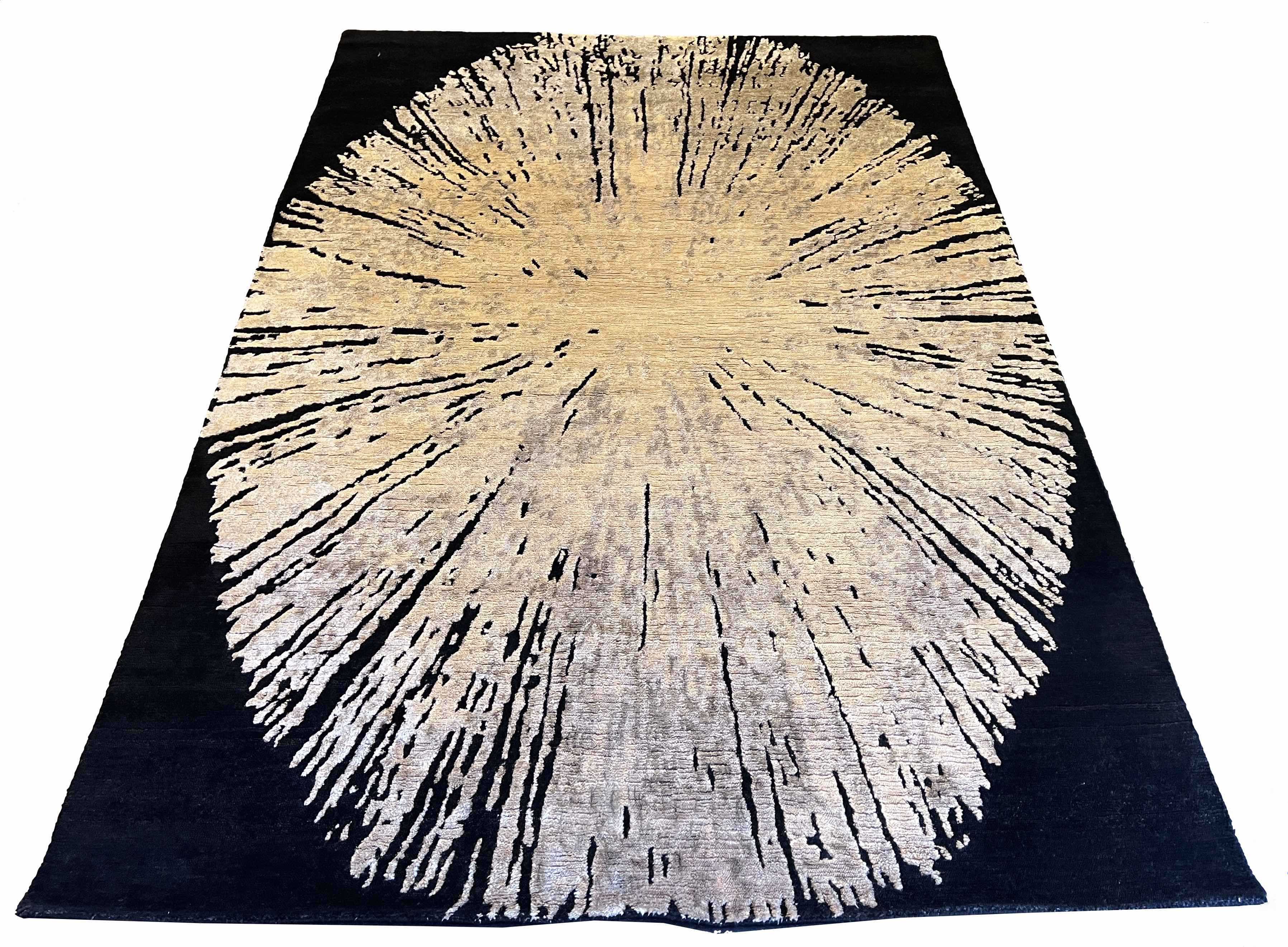 Luxury modern abstract rug featuring a large elliptical geometric sunburst in gold silk against a black wool background - #6077-CLA-111.
