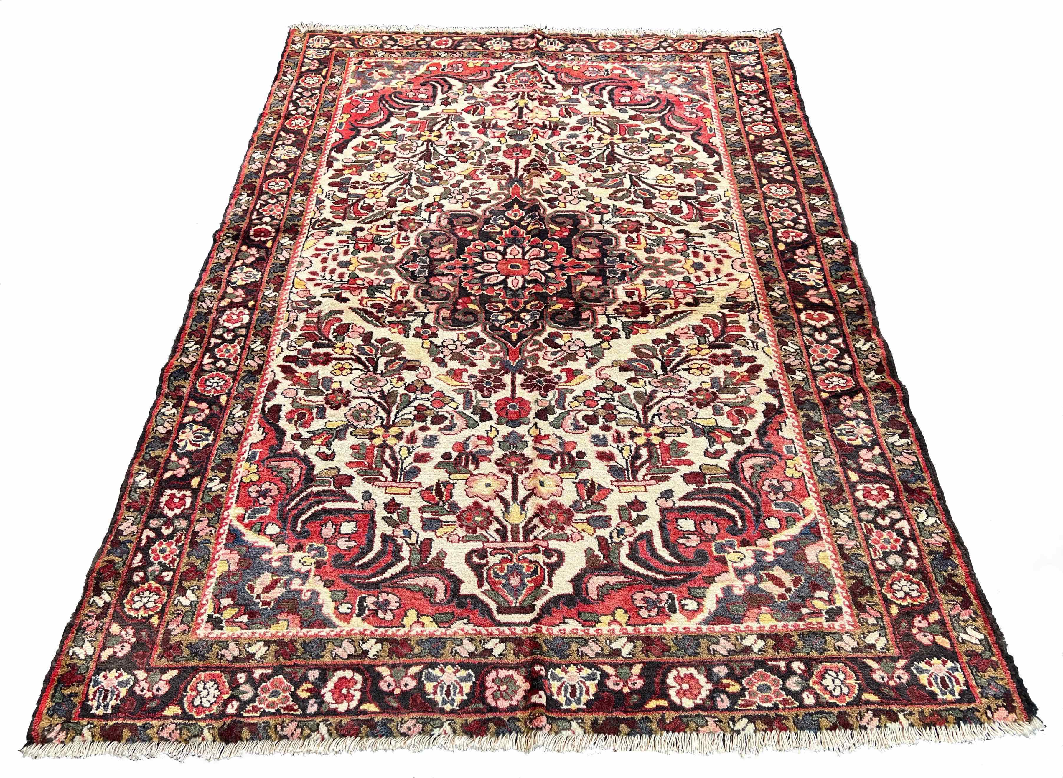 Angular perspective of hand-knotted vintage Persian Afshar rug 7577 on wool on cotton base highlighting the muted grey and brown tones and natural wool luster.