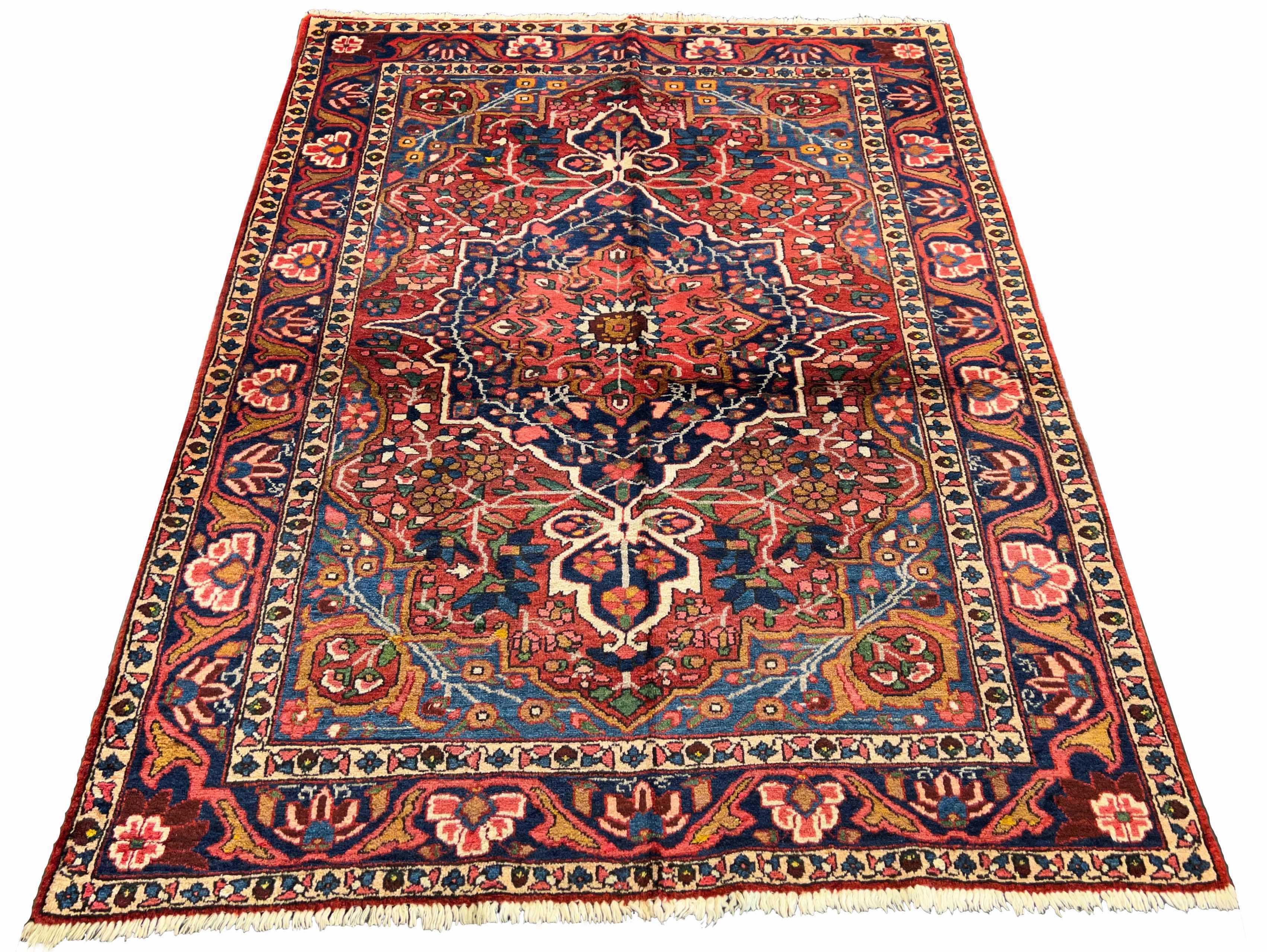 Authentic #7523 vintage Persian Bakhtiar wool on cotton base rug with geometric medallion by AL-SHAHZADI HK LIMITED.