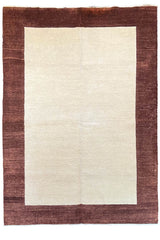 Flat lay top view of hand-knotted Gabbeh rug 3741; solid ivory field framed by a thick chocolate brown border.