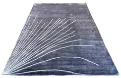 Sleek handmade modern grey rug in 100% bamboo silk with a white abstract fanned-out pattern #7975.