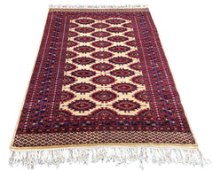 Regal hand-knotted Pakistan Sarooq rug featuring deep ruby red and indigo floral medallions on a cotton base #3387.
