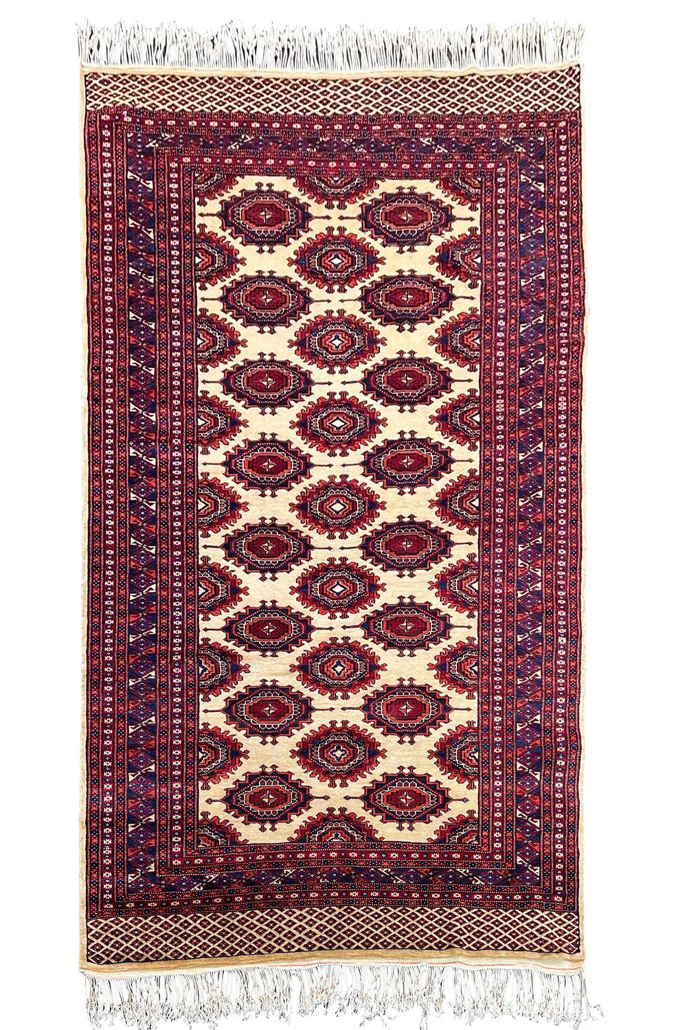 Regal hand-knotted Pakistan Sarooq rug featuring deep ruby red and indigo floral medallions on a cotton base #3387.