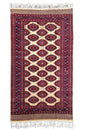 Regal hand-knotted Pakistan Sarooq rug featuring deep ruby red and indigo floral medallions on a cotton base #3387.