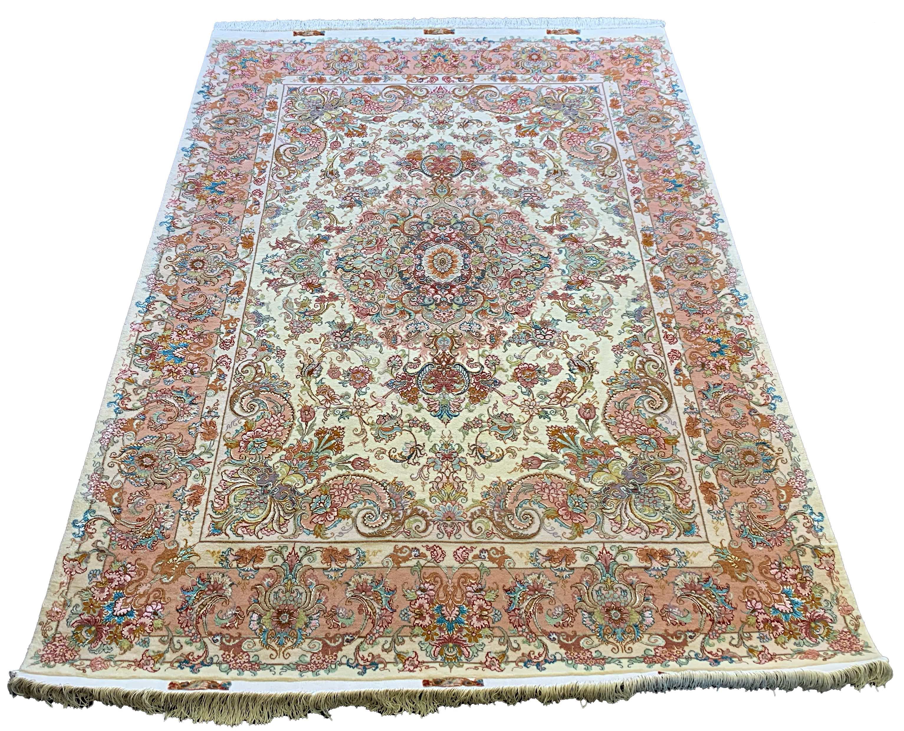 Hand-knotted Persian Beige Tabriz rug in wool on a silk foundation featuring peach floral motifs #5616.