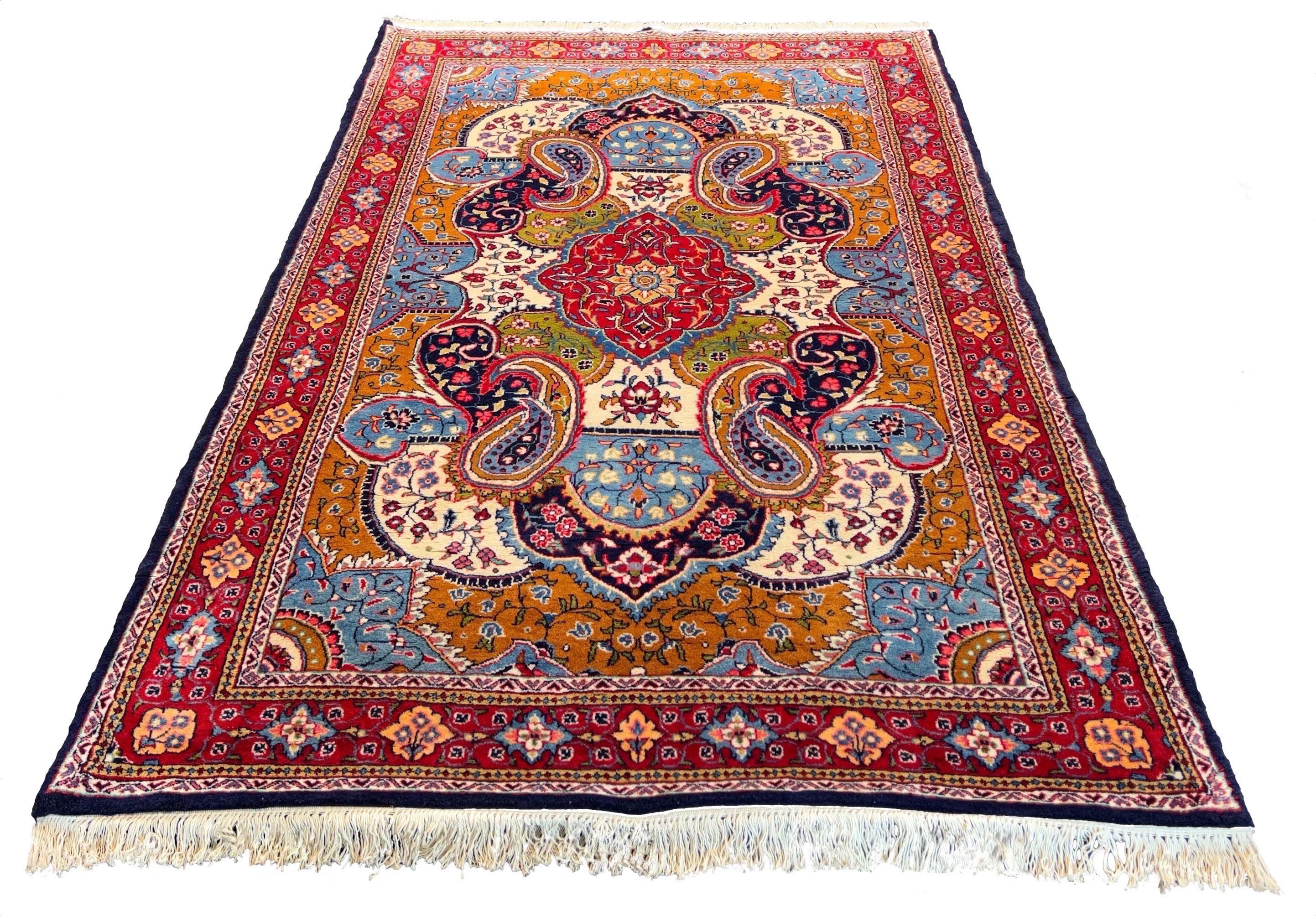Hand-knotted Sarooq rug in 100% wool on a cotton base featuring multi-color scrolling paisley medallions and floral vines - #7568.