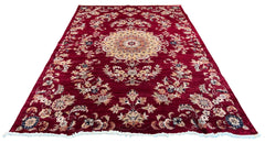 Ornate handmade Pakistan Isfahan rug with a cherry red field, cream central medallion, and floral arabesques #6513.