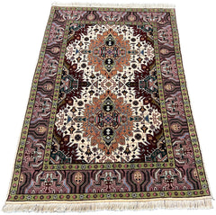 Hand-knotted Tabriz rug in 100% wool on a cotton base featuring two geometric diamond medallions on an ivory field - #7278.