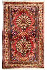 Vintage hand-knotted Bakhtiar rug in 100% wool on a cotton base featuring two large floral medallions on a red field - #7551.