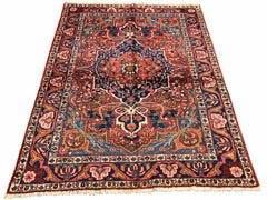 Authentic #7523 vintage Persian Bakhtiar wool on cotton base rug with geometric medallion by AL-SHAHZADI HK LIMITED.